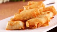 Spring rolls offered by hawkers